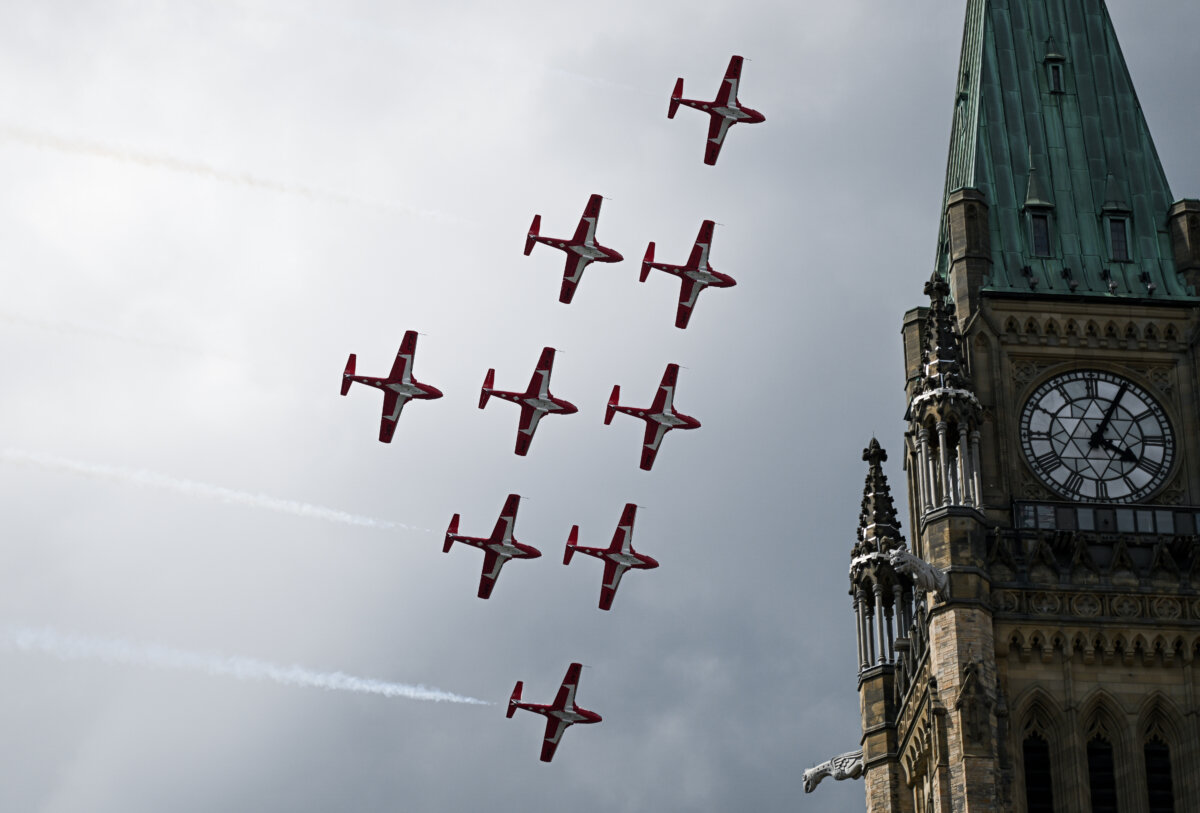 File photo -- Royal Canadian Air Force (RCAF) Snowbirds conduct a fly-past over Parliament Hill during Canada Day celebrations at LeBreton Flats in Ottawa, on July 1, 2025. (The Canadian Press/Spencer Colby)
