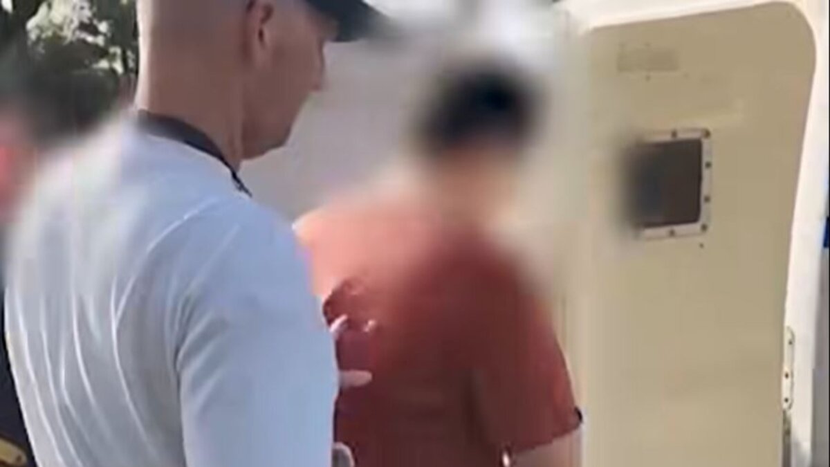 The 62nd and final alleged offender captured by Strike Force Glandore is loaded into the rear of a police wagon in Corrimal, New South Wales, on May 7, 2026. (Courtesy NSW Police)