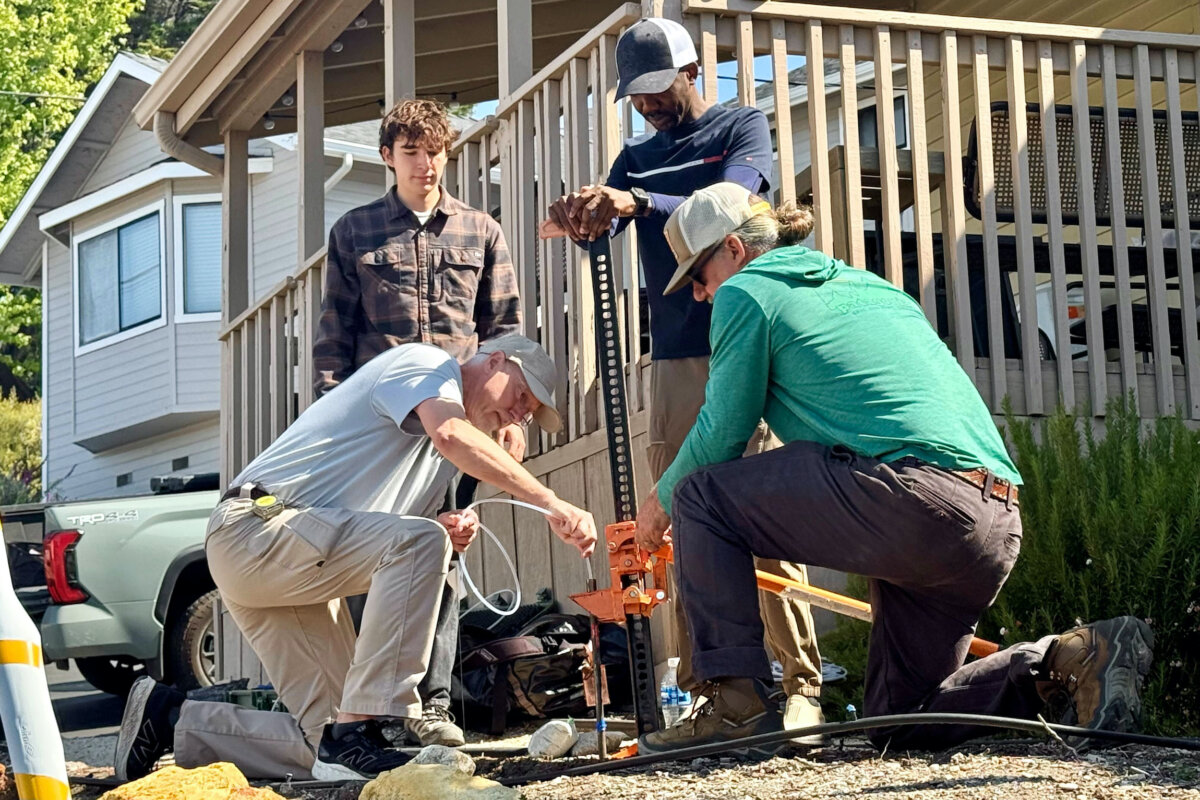 Scientists take samples from the soil from the neighboring yard of a home in Arroyo Grande, Calif., connected to the man convicted of killing Kristin Smart as part of a sheriff's investigation, on May 7, 2026. (Haven Daley/AP Photo)