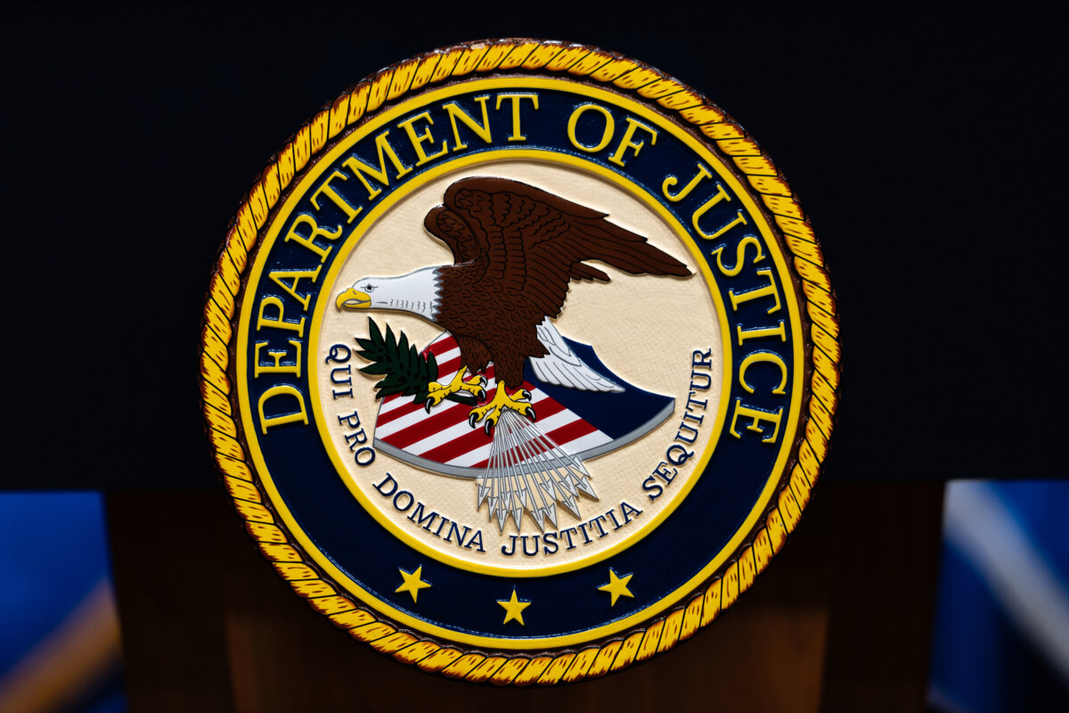 The U.S. Department of Justice logo is seen on a podium before a news conference in Washington on May 4, 2026. (Julia Demaree Nikhinson/AP Photo)