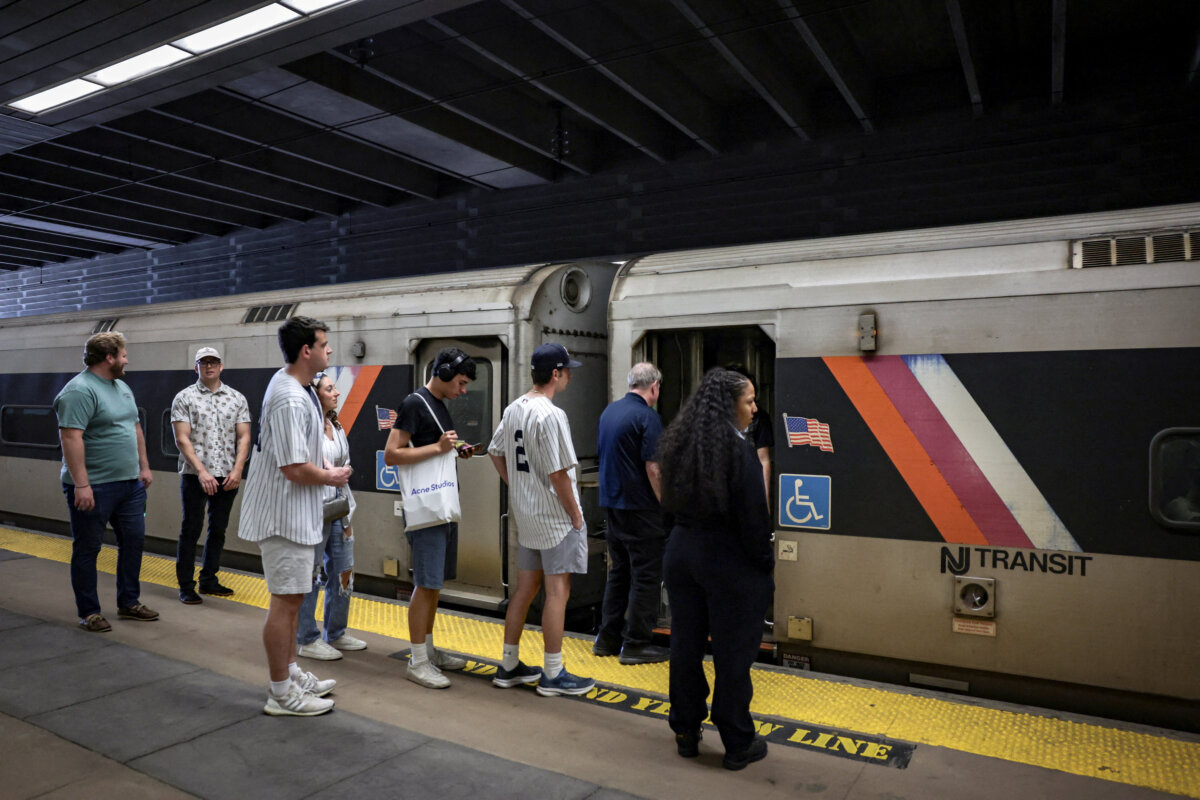People wait to board a NJ Transit train at the Secaucus Junction station on the day of the announcement of public transit ticket prizes to World Cup games in New Jersey, in Secaucus, N.J., on April 17, 2026. (Jeenah Moon/Reuters)