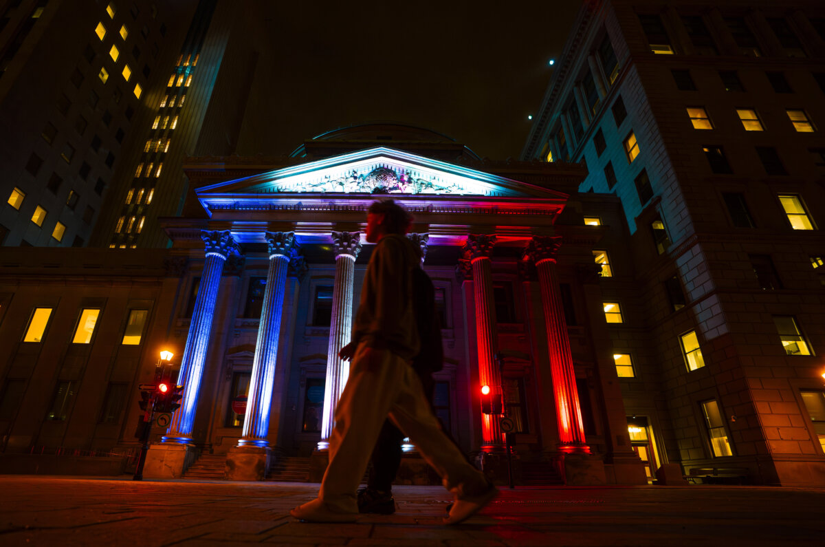 The Bank of Montreal shows support for the Montreal Canadiens NHL hockey team by displaying the team's colours on their building in Montreal on May 8, 2026. (The Canadian Press/Christinne Muschi)