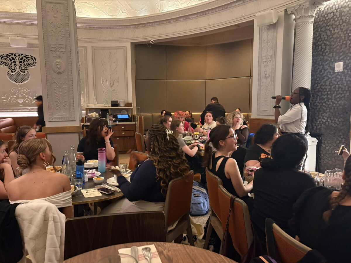 Gayle's Broadway Rose waitress Faith Jones serenades a dinner crowd inside the Hotel Edison. (Photo courtesy of Alison Ramsey)