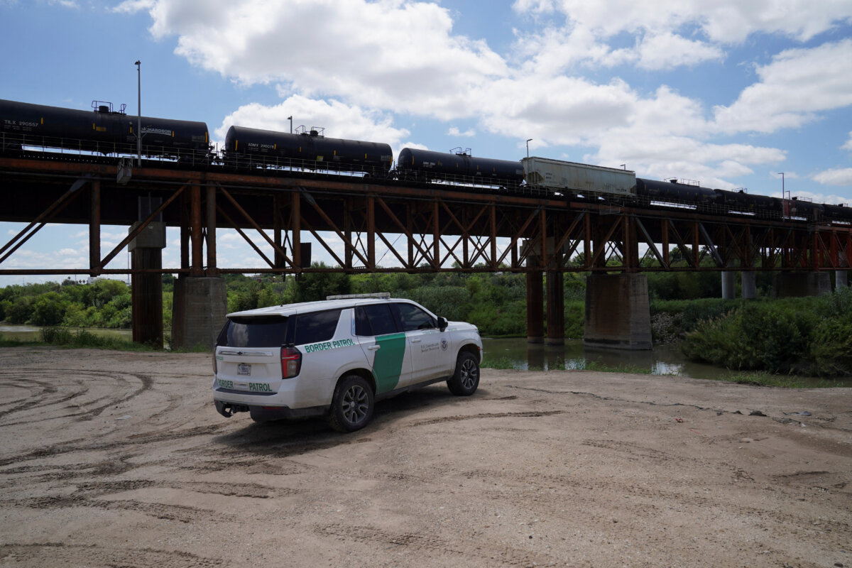 Border Patrol agents oversee the Rio Grande after six bodies were found on Sunday in a train boxcar, in Laredo, Texas, on May 11, 2026. (Gabriel V. Cardenas/Reuters)