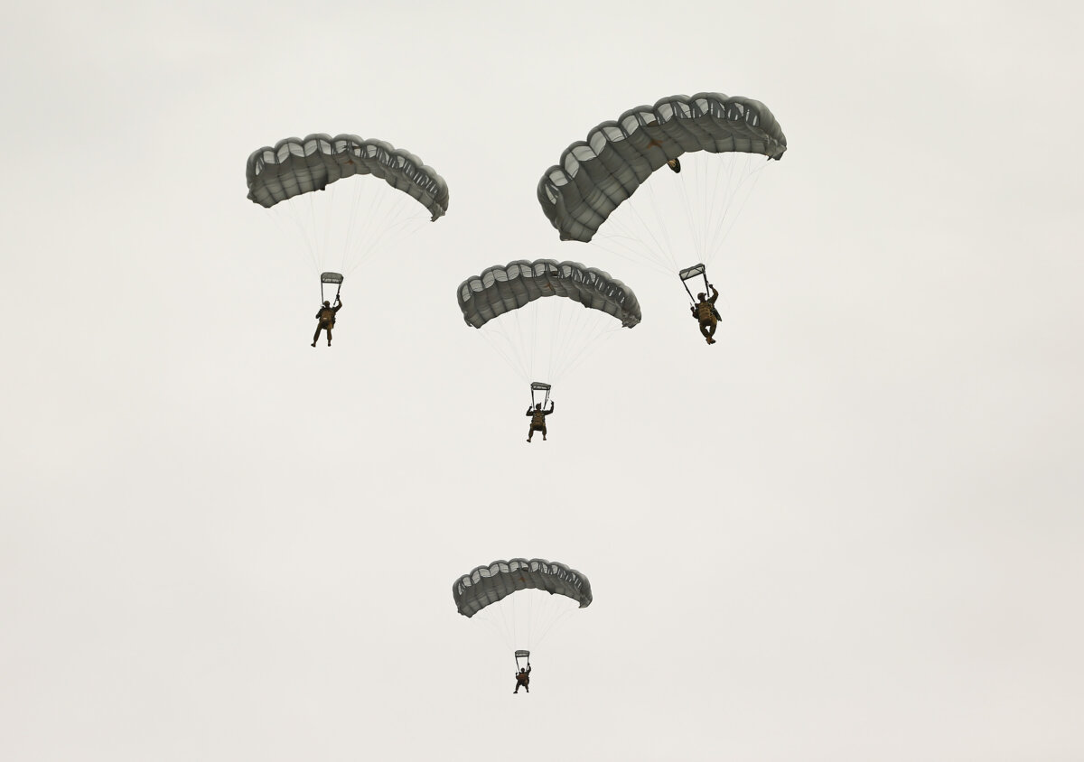 Parachutists float to the ground as they perform at the Australian International Airshow in Avalon, Australia, on Feb. 27, 2015. (Scott Barbour/Getty Images)