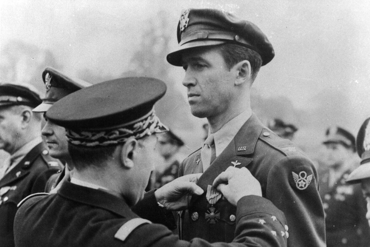 Lt. Gen. Henri Valin, Chief of Staff of the French Air Force, awards Col. Jimmy Stewart the Croix de Guerre with bronze palm (the highest degree of this award) for his exceptional services in the liberation of France, circa 1945. (U.S. Air Force photo)