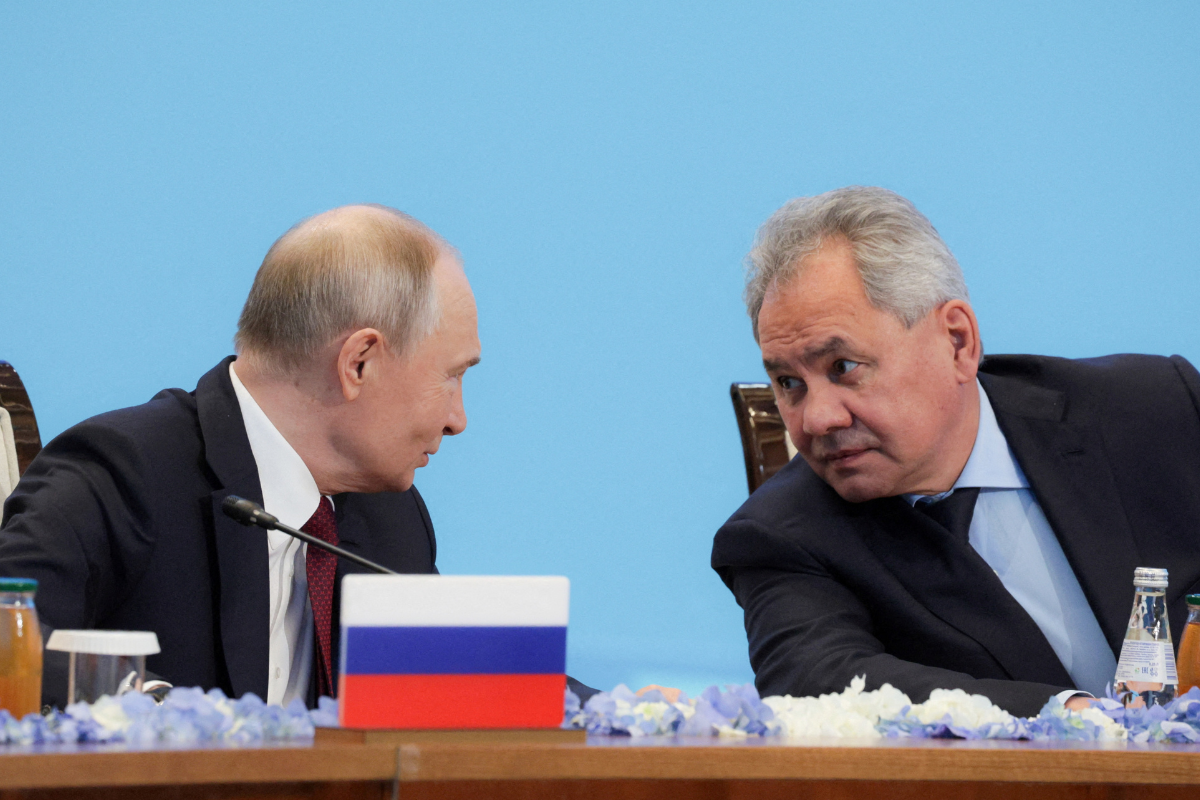 Russian President Vladimir Putin speaks with Security Council Secretary Sergei Shoigu at the Collective Security Treaty Organisation summit in Astana, Kazakhstan, on Nov. 28, 2024. (Sputnik/Gavriil Grigorov/Kremlin via Reuters)