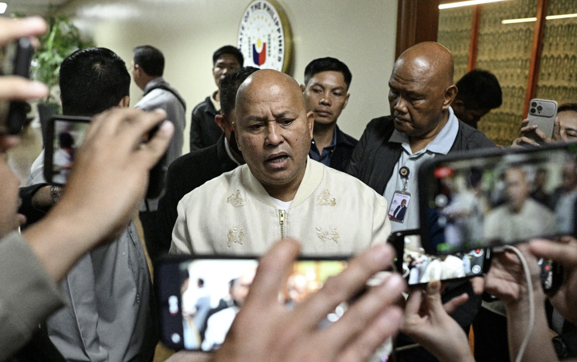 Senator Ronald dela Rosa (C) answers questions from reporters at the Senate in Pasay City, Metro Manila, Philippines, on May 12, 2026. (Noel Celis/Reuters)