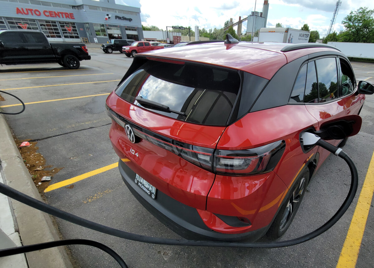 A 2022 Volkswagen ID. 4 EV is shown at a charging station at a Scarborough, Ontario Canadian Tire on June 14, 2023. (The Canadian Press/Doug Ives)