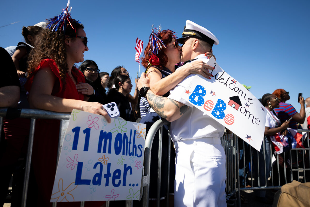 Juan Caceres kisses Heidi Eckstein after disembarking aircraft carrier USS Gerald R. Ford at Naval Station Norfolk in Norfolk, Va., on May 16, 2026. (Mike Kropf/Getty Images)