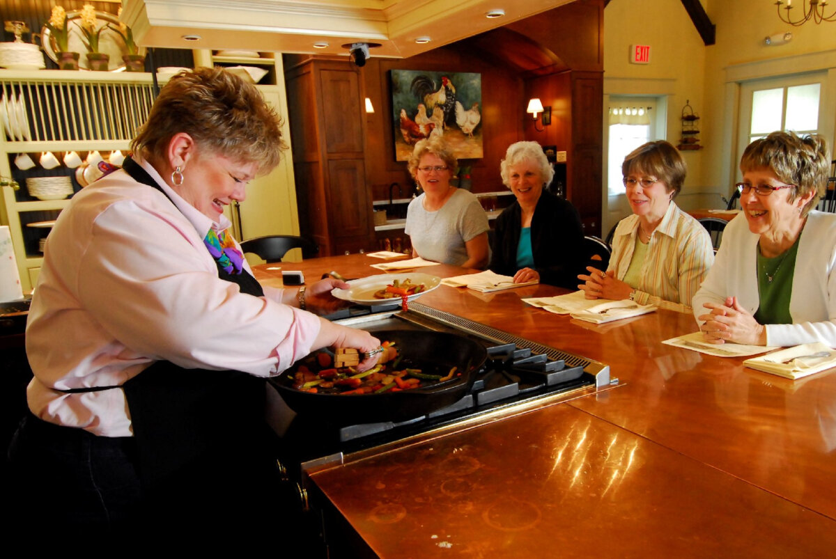 Participants enjoy enhancing their culinary skills in cooking classes across the country. (Courtesy of Dreamstime)