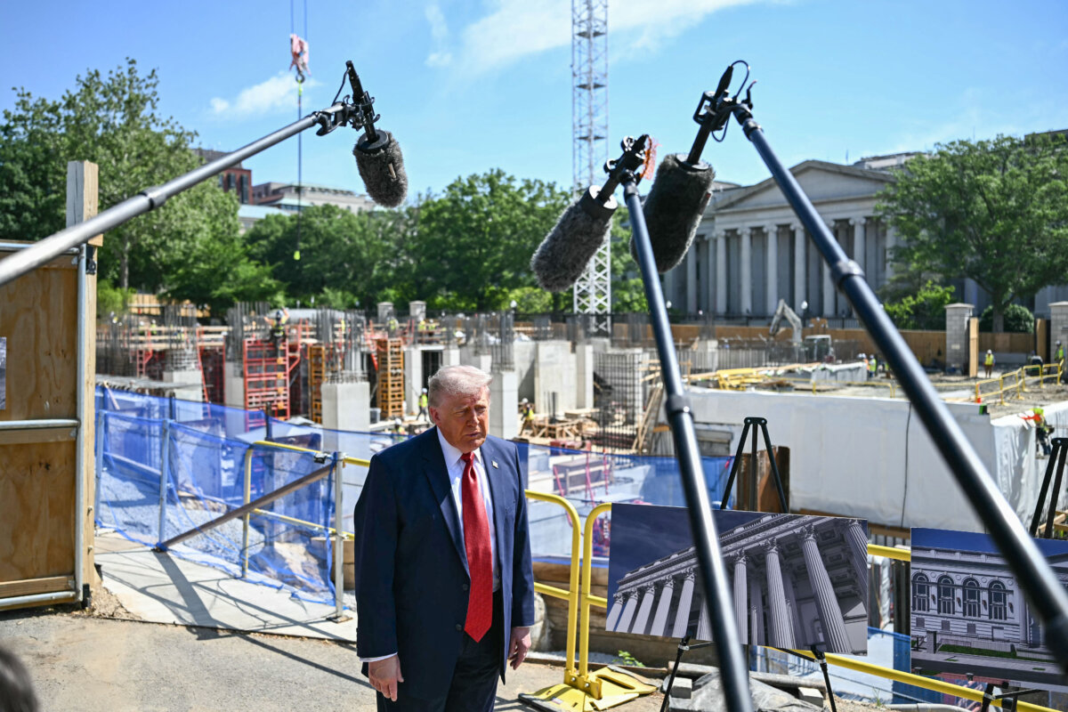 President Donald Trump speaks to reporters near the construction site of his proposed ballroom at the White House on May 19, 2026. (Kent Nishimura/AFP via Getty Images)