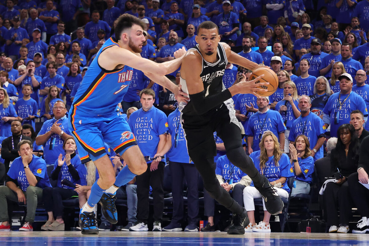 Victor Wembanyama (1) of the San Antonio Spurs drives to the basket against Chet Holmgren (7) of the Oklahoma City Thunder during the fourth quarter in Game One of the NBA Western Conference Finals at Paycom Center in Oklahoma City, Okla., on May 18, 2026. (Alex Slitz/Getty Images)