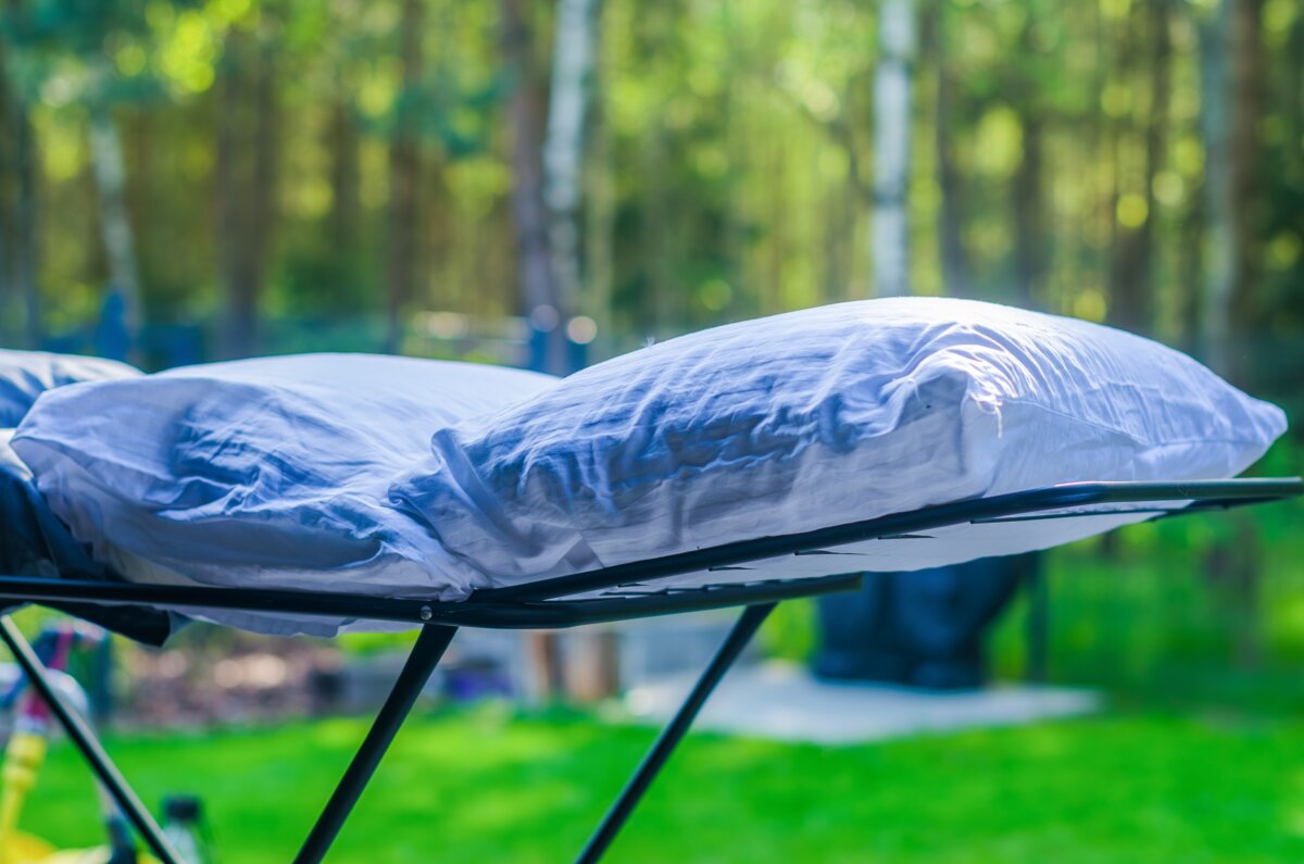 Check to make sure the pillow tag says that it is washable. Most pillows can be safely washed. (Yuliy Sheynina/Shutterstock)