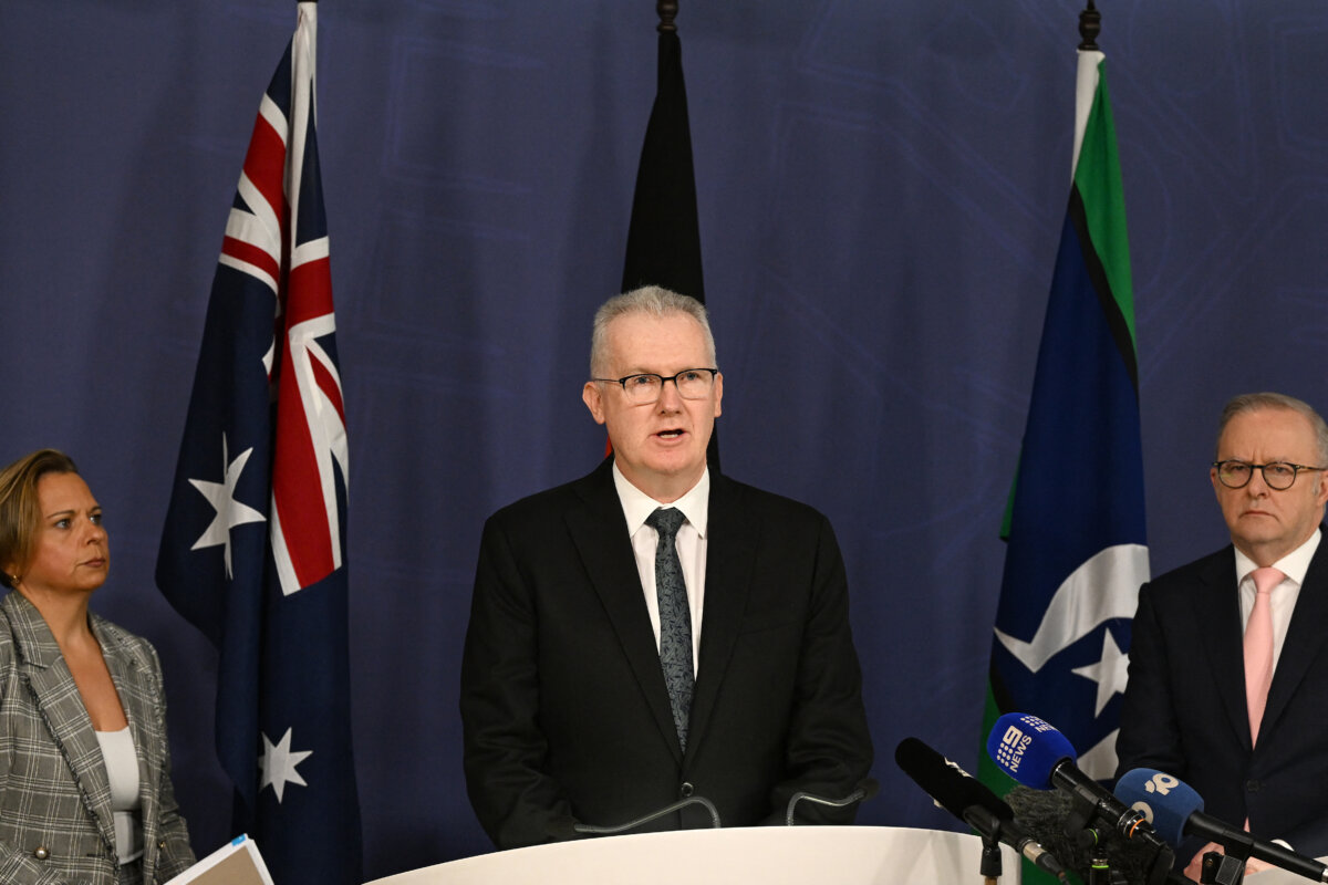 Australia's Home Affairs Minister Tony Burke speaks on the Royal Commission while Prime Minister Anthony Albanese and Attorney-General Michelle Rowland look on during a press conference in Sydney on April 30, 2026. (Saeed Khan/AFP via Getty Images)