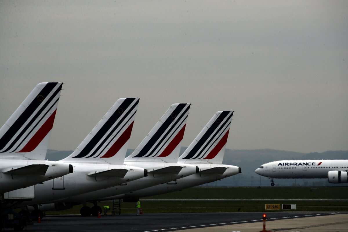 Air France planes are parked on the tarmac at Paris Charles de Gaulle airport, in Roissy, near Paris, on May 17, 2019. (AP Photo/Christophe Ena)
