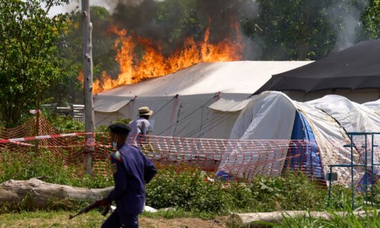 Crowd Sets Ebola Treatment Center Ablaze in Congo Amid Dispute Over Dead Body