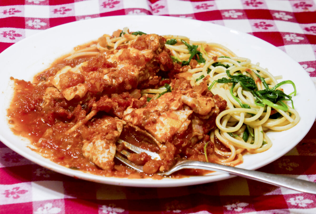 Pork parmesan with spaghetti with peppery arugula. (Linda Gassenheimer/TNS)