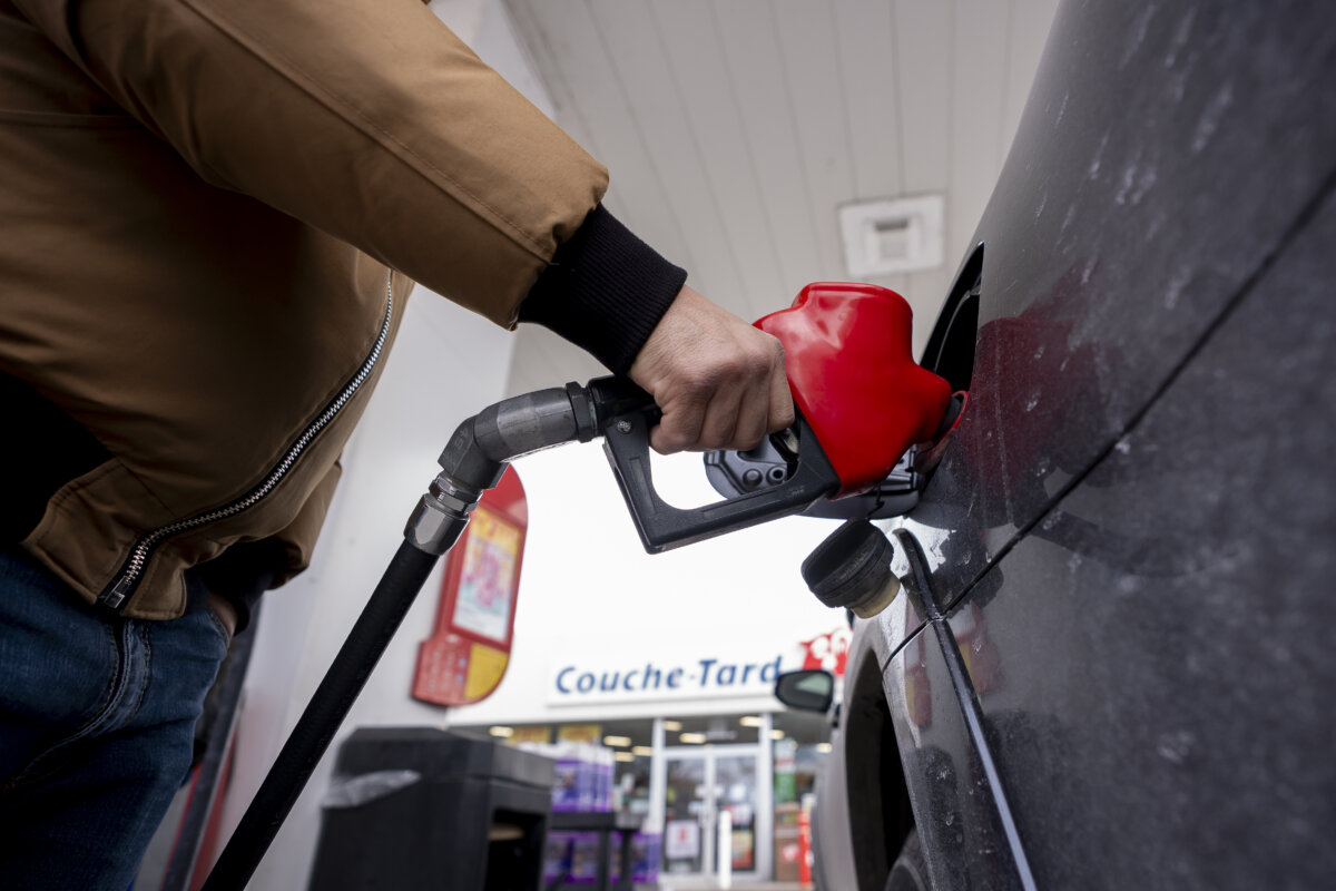 A person fills up their car at a gas station in Montreal on March 5, 2026. (The Canadian Press/Christopher Katsarov)