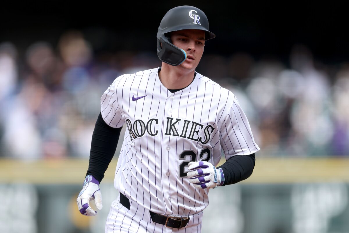 Mickey Moniak #22 of the Colorado Rockies circles the bases after hitting a solo home run against the San Diego Padres in the first inning at Coors Field in Denver, Colorado on April 23, 2026. (Matthew Stockman/Getty Images)