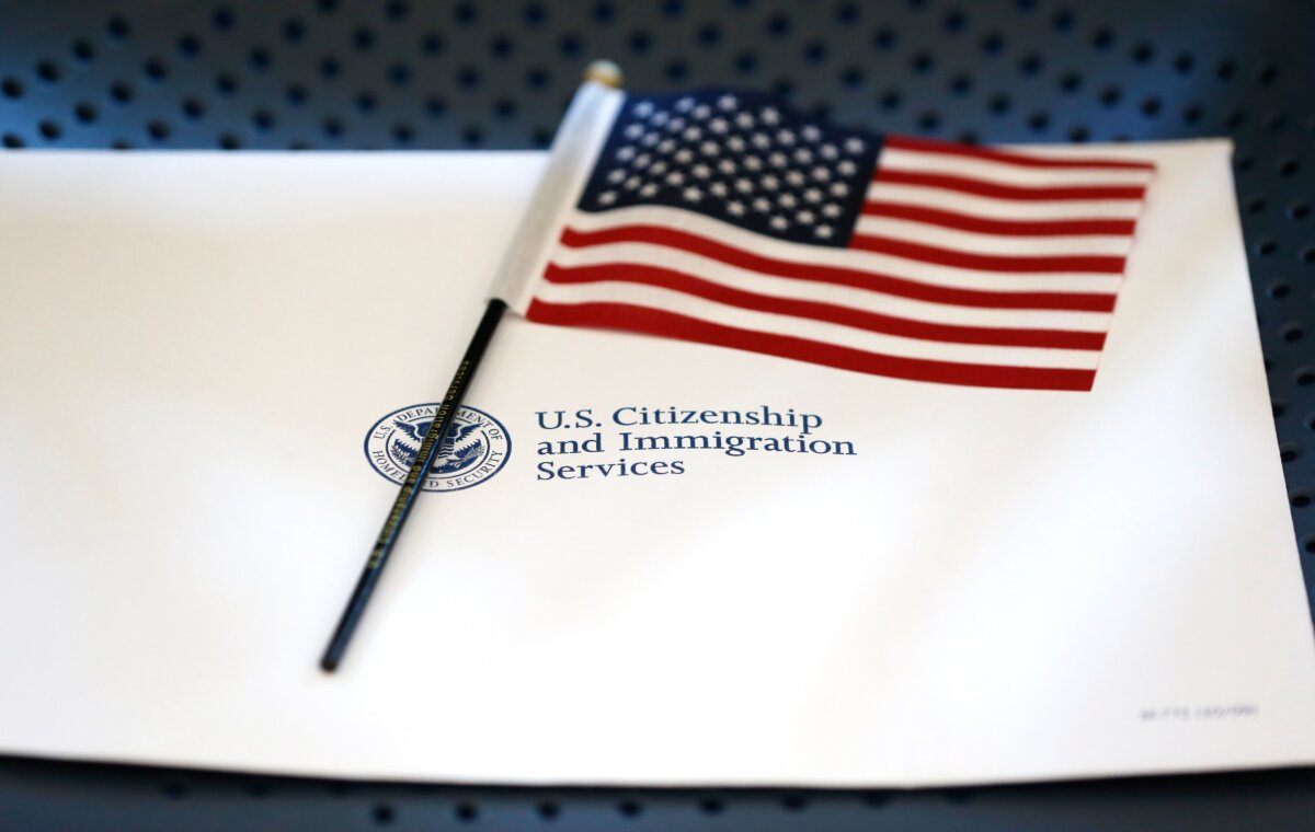 An information packet and an American flag placed on a chair at the U.S. Citizenship and Immigration Services Miami Field Office in Miami on Aug. 17, 2018. (Wilfredo Lee/AP Photo)