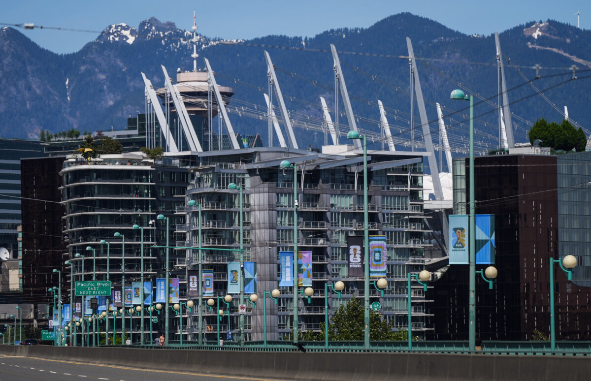 FIFA World Cup banners are seen on light standards on the Cambie Bridge, in Vancouver, on May 4, 2026. (The Canadian Press/Darryl Dyck)