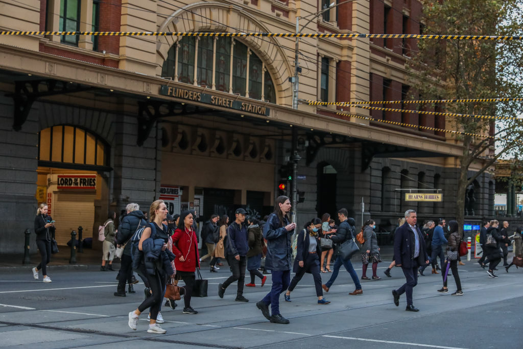 Commuters are seen walking past flinders street station in Melbourne, Australia, on May 25, 2021. (Asanka Ratnayake/Getty Images)