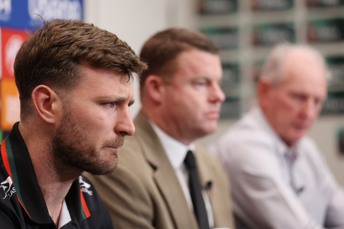 Jai Arrow, Rabbitohs CEO Blake Solly and Rabbitohs Coach Wayne Bennett attend a press conference in Sydney, Australia, on May 20, 2026. (Mark Metcalfe/Getty Images)