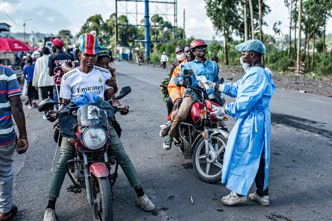 Health workers conduct temperature screenings and health checks on travelers at a check point in Goma, Congo, on May 24, 2026. (Daniel Buuma/Getty Images)