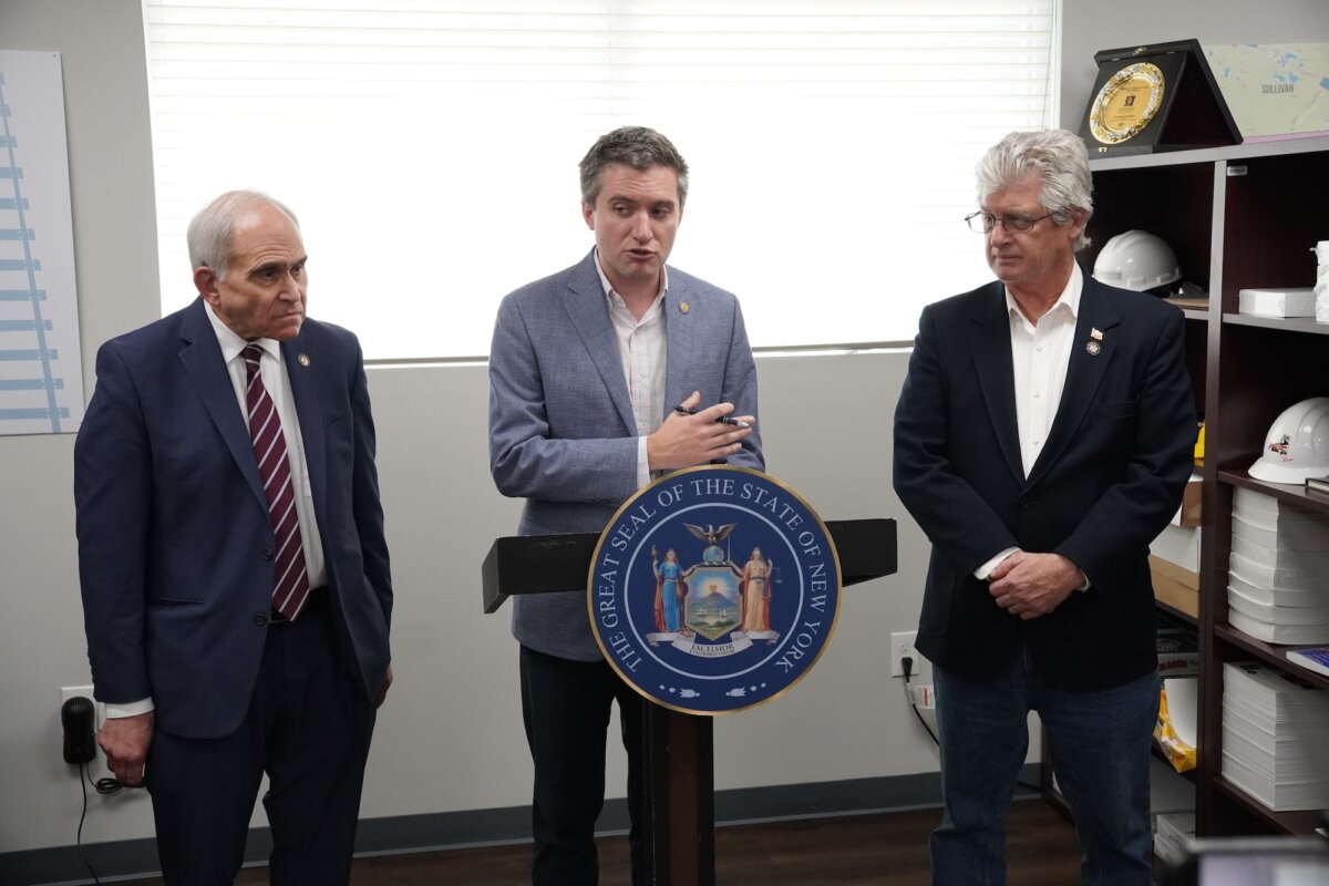 State Sen. James Skoufis (C), alongside Assemblymembers Jonathan Jacobson (L) and Chris Eachus at Skoufis's office in the Town of Cornwall, N.Y., on May 22, 2026. (Oliver Mantyk/The Epoch Times)