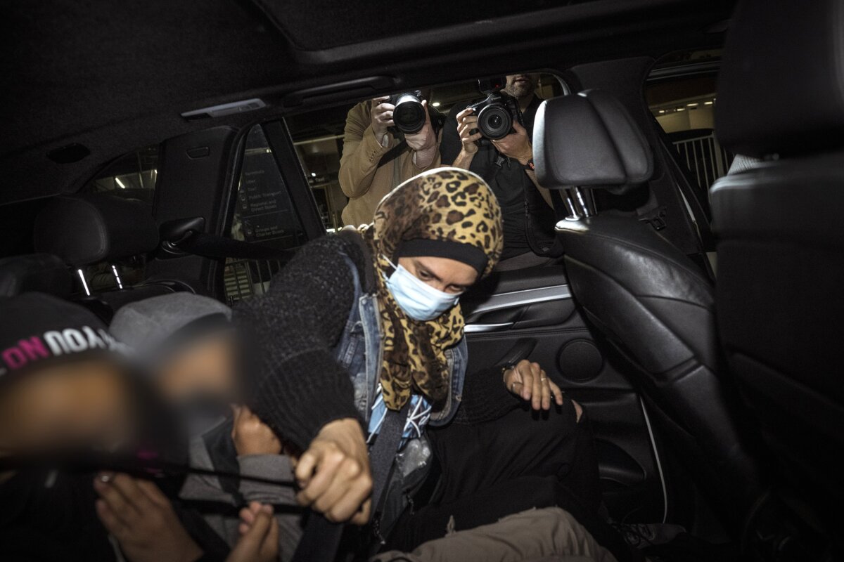 An ISIS-linked family as they arrive at Melbourne International Airport in Melbourne, Australia on May 26, 2026. (AAP Image/Christopher Hopkins)