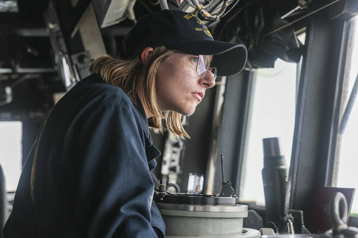 A U.S. Sailor stands watch in the pilothouse aboard USS John Finn. Courtesy of CENTCOM
