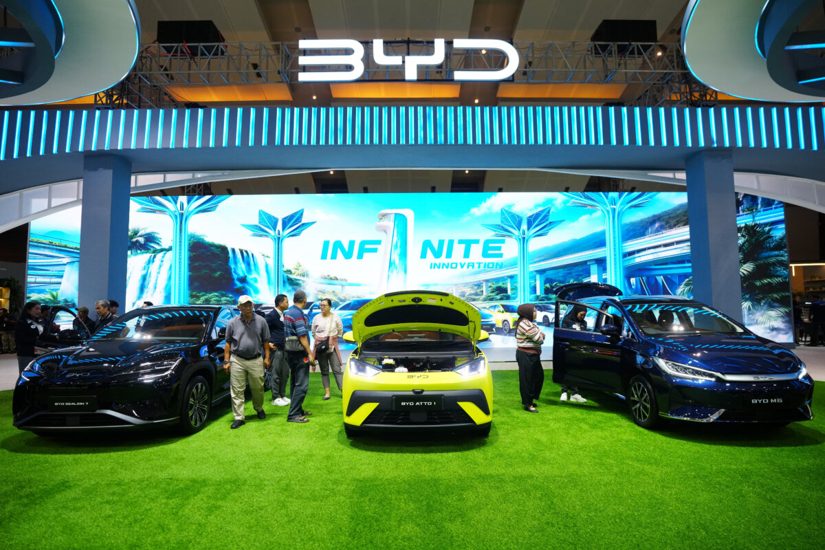 Visitors look at vehicles at a booth for BYD, a Chinese electric vehicle automaker, during the Indonesian International Motor Show in Jakarta, Indonesia, on Feb. 7, 2026. (Tatan Syuflana/AP Photo)
