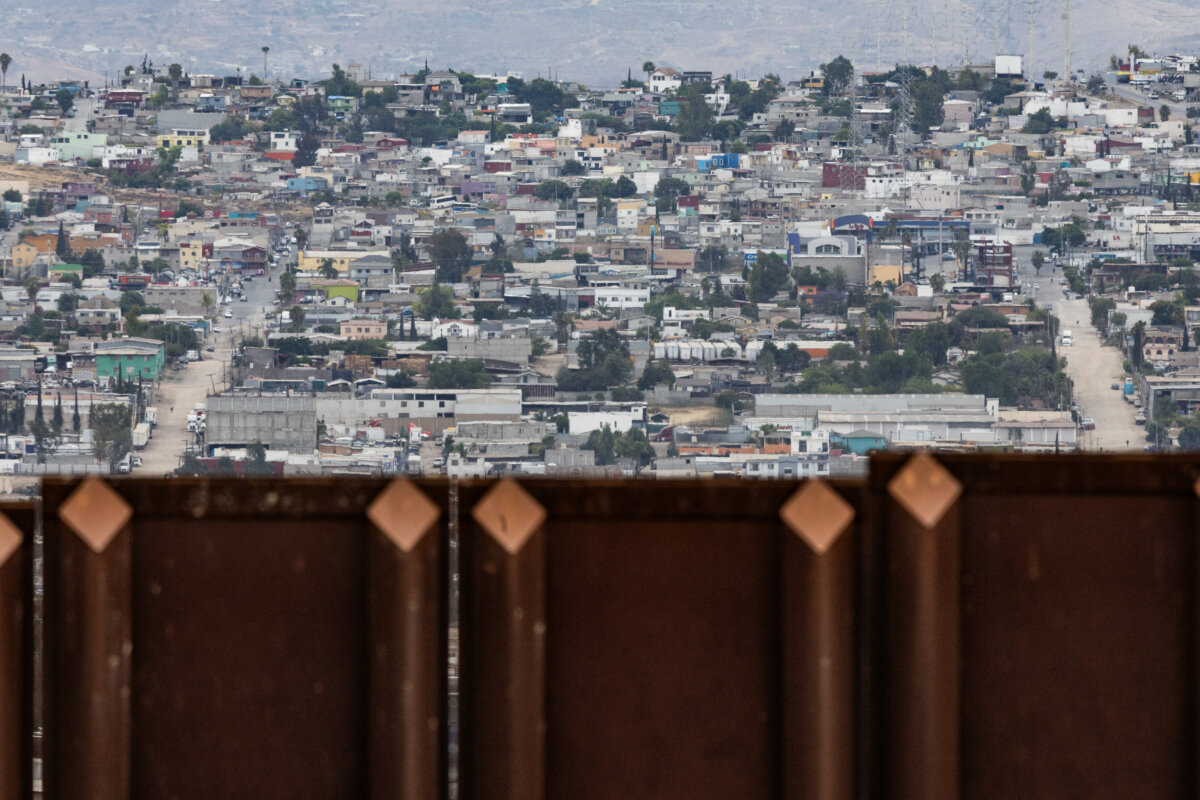 The southern border wall overlooking Tijuana, Mexico, seen from outside of San Diego, on May 27, 2026. (John Fredricks/The Epoch Times)