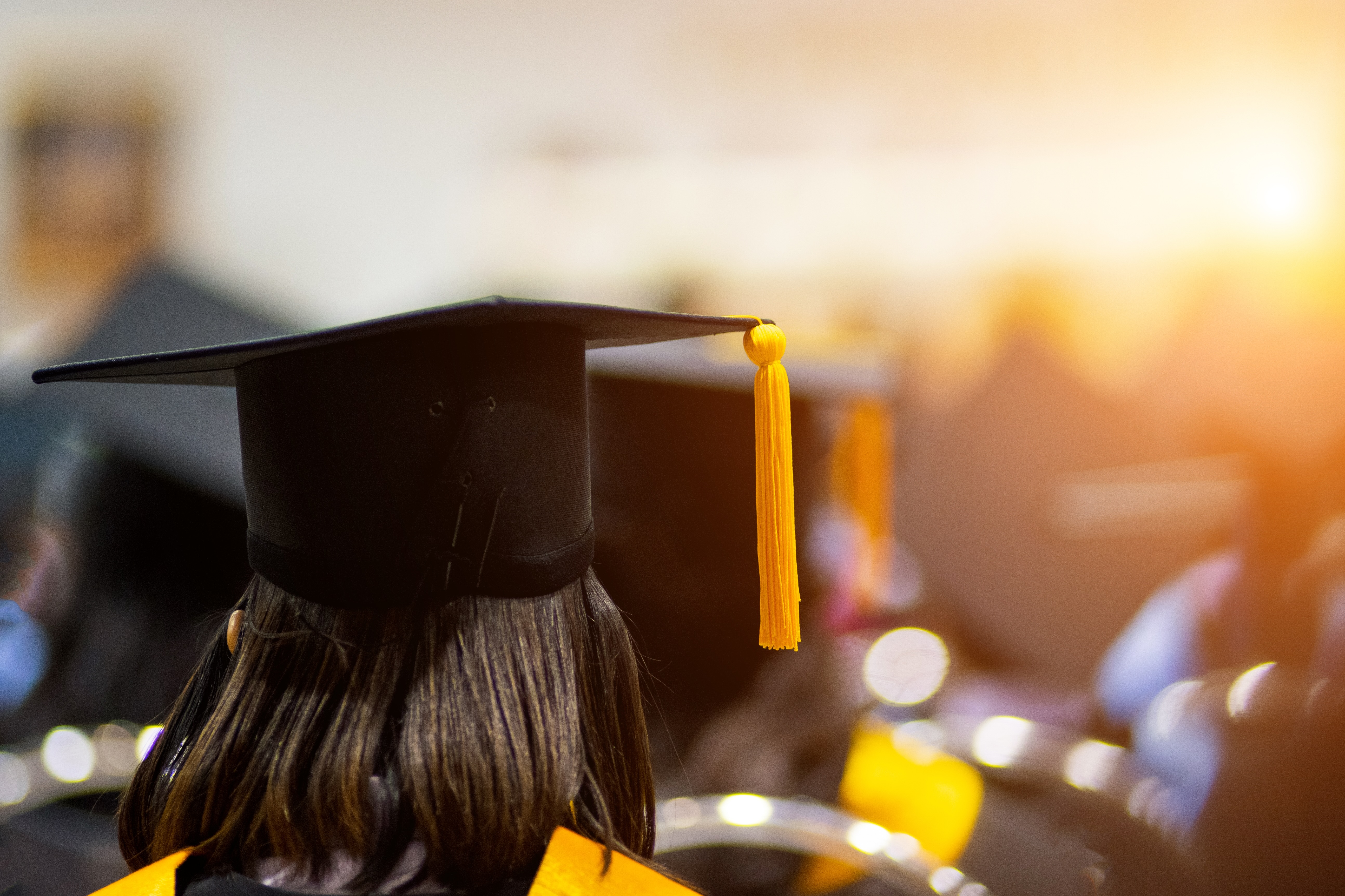 Rear,View,Of,The,University,Graduates,Line,Up,For,Degree
