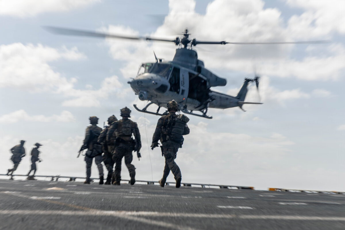U.S. Marines assigned to Littoral Combat Force-24, approach a UH-1Y Venom helicopter during a maritime interdiction
rehearsal aboard USS Fort Lauderdale, while underway in the Caribbean Sea, on May 22, 2026. (U.S. Marine Corps)