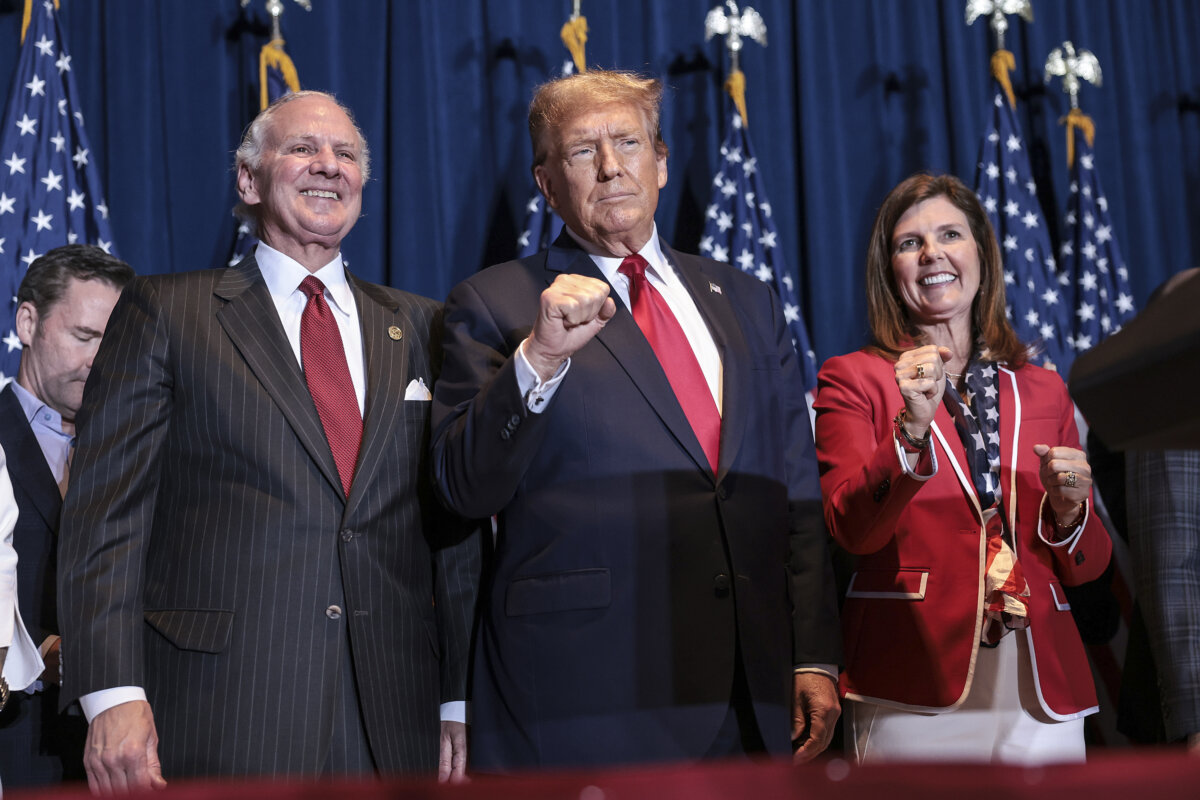 (L–R) South Carolina Gov. Henry McMaster, Republican presidential candidate and former President Donald Trump, and Lt Gov. Pamela Evette during an election night watch party at the State Fairgrounds in Columbia, S.C., on Feb. 24, 2024. (Win McNamee/Getty Images)