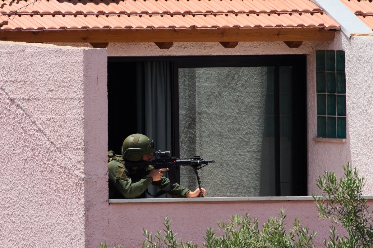 An Israeli solider takes a position in a house in Metula, northern Israel, on the border with Lebanon, on May 31, 2026. (Ariel Schalit/AP Photo)