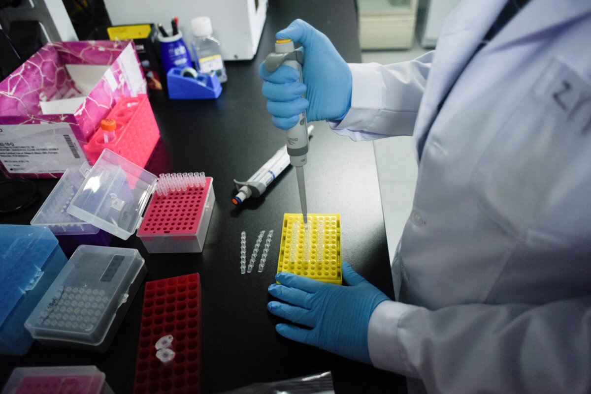 A researcher at Peking University's Beijing Advanced Innovation Center for Genomics conducts tests at their laboratory in Beijing on May 14, 2020. (Wang Zhao/AFP via Getty Images)