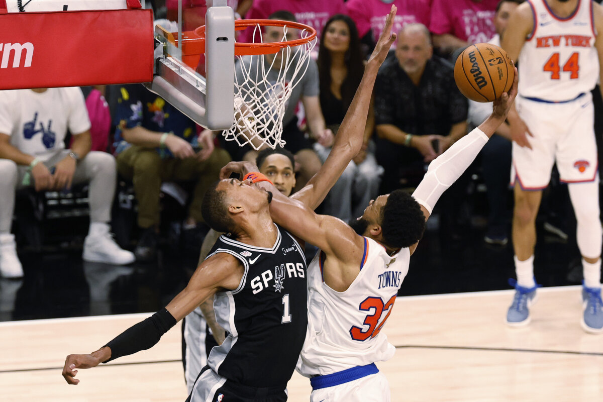 Karl-Anthony Towns #32 of the New York Knicks shoots the ball against Victor Wembanyama #1 of the San Antonio Spurs during the second quarter in Game One of the 2026 NBA Finals at Frost Bank Center in San Antonio, Texas, on June 03, 2026. (Ronald Cortes/Getty Images)