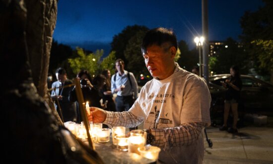 Holding Candles Up High, They Denounce Beijing’s Tyranny