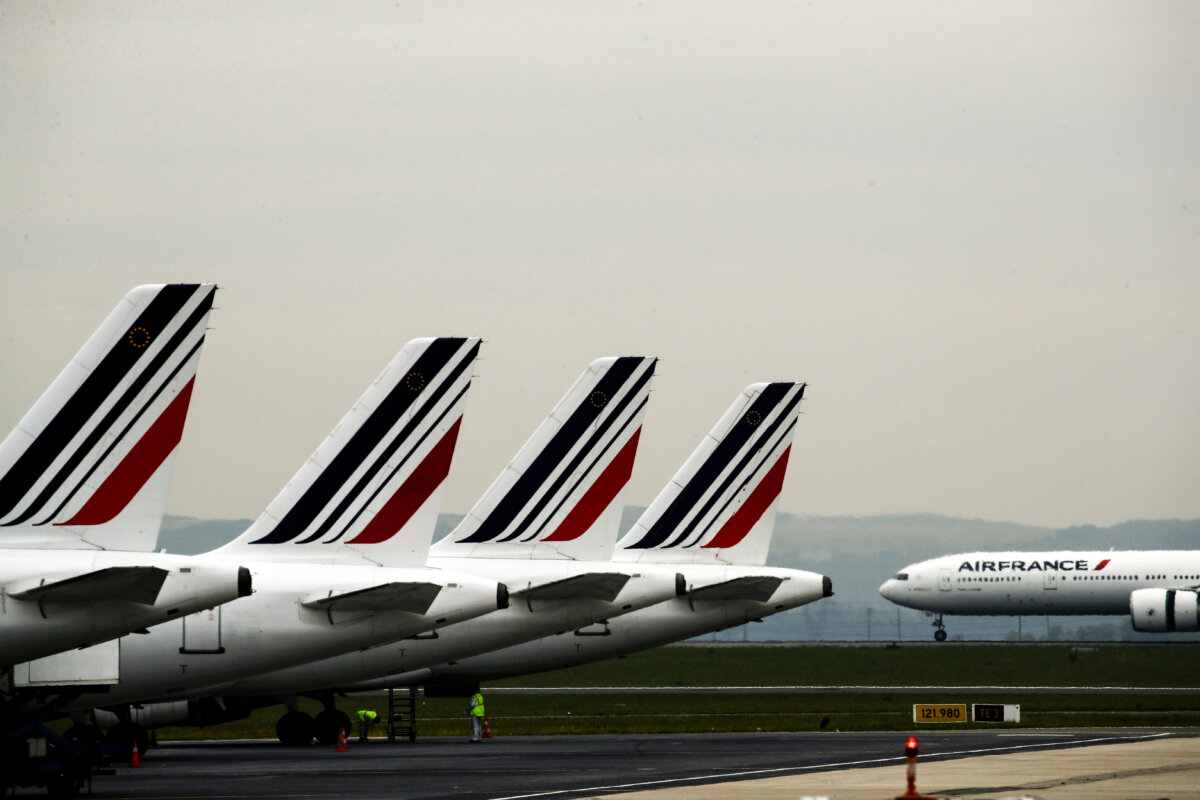 Air France planes are parked on the tarmac at Paris Charles de Gaulle airport, in Roissy, near Paris, on May 17, 2019. (AP Photo/Christophe Ena)