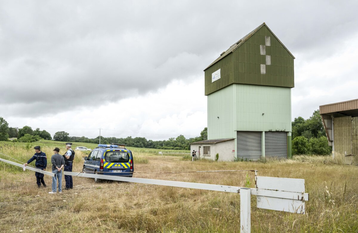 French police guard a farm silo - where the body of an 11-year-old girl was found - in Puycasquier, southwestern France, on June,5, 2026. (Frederic Lancelot/AP)