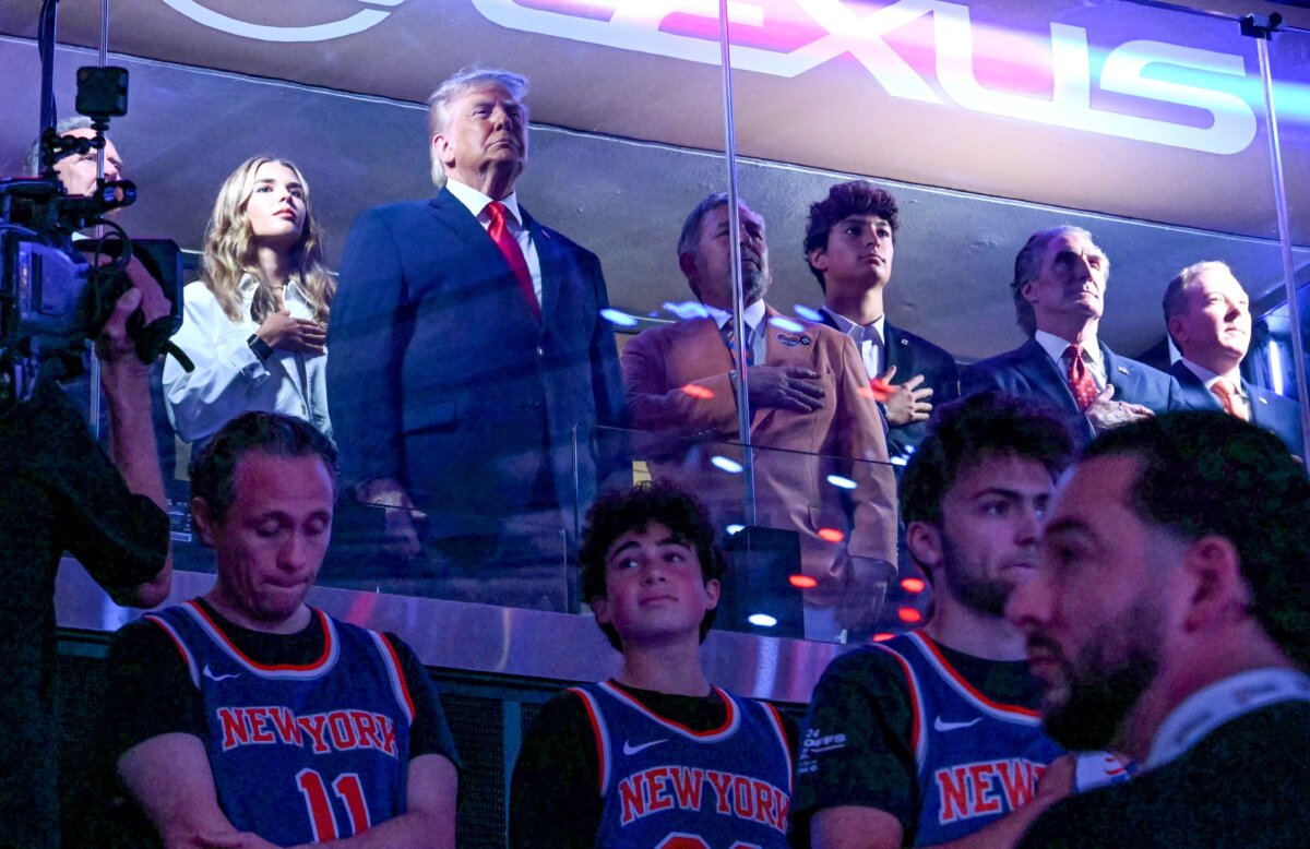 President Donald Trump with his grand daughter Kai Trump (L), Knicks owner James Dolan (3rd L), Secretary of the Interior Doug Burgum (3rd R) and Environmental Protection Agency director Lee Zeldin (2nd R) attend Game Three of the NBA Finals between the San Antonio Spurs and the New York Knicks at Madison Square Garden in New York City on June 8, 2026. (Saul Loeb/AFP via Getty Images)
