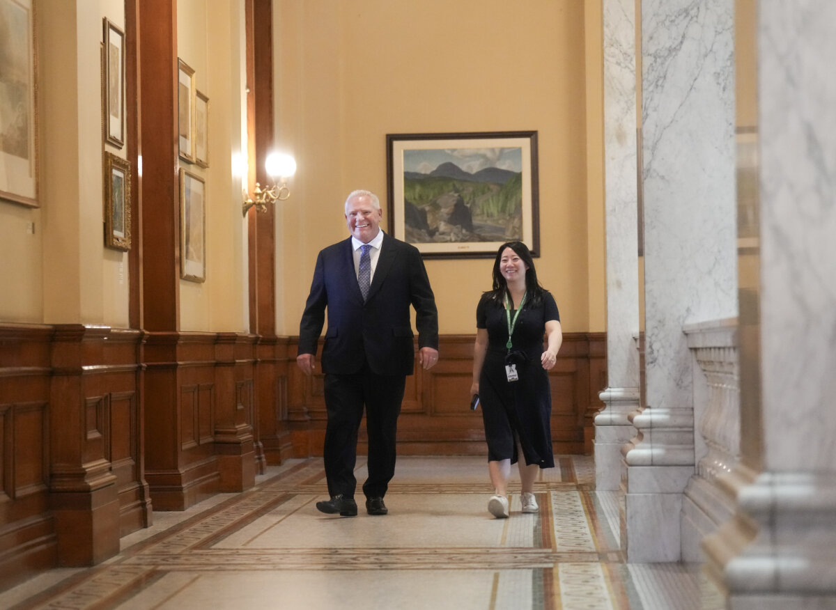 Ontario Premier Doug Ford, left, walks to his caucus meeting after the last sitting day in the legislature before summer break at Queen's Park in Toronto on June 2, 2026. (The Canadian Press/Nathan Denette)