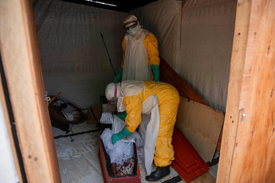 Workers prepare the body of a child believed to have died from Ebola, in Bunia, Congo, on June 9, 2026. (Jospin Mwisha/AFP via Getty Images)