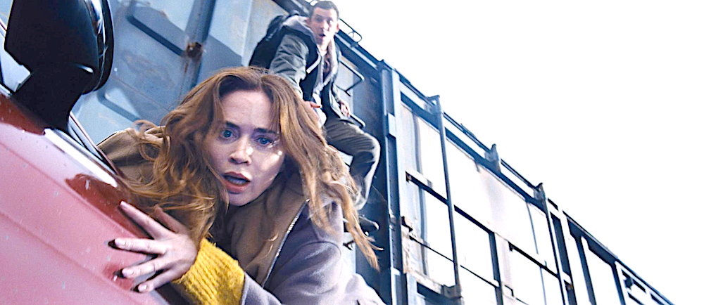 man and woman try to escape from a car to a train in Disclosure Day