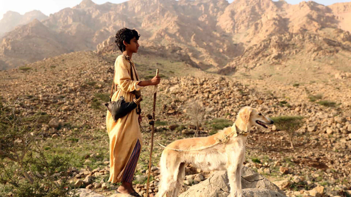 Suhail (Naser Salah) and his dog, Barakah, travel through the desert, in "Mountain Boy." (GJW+)