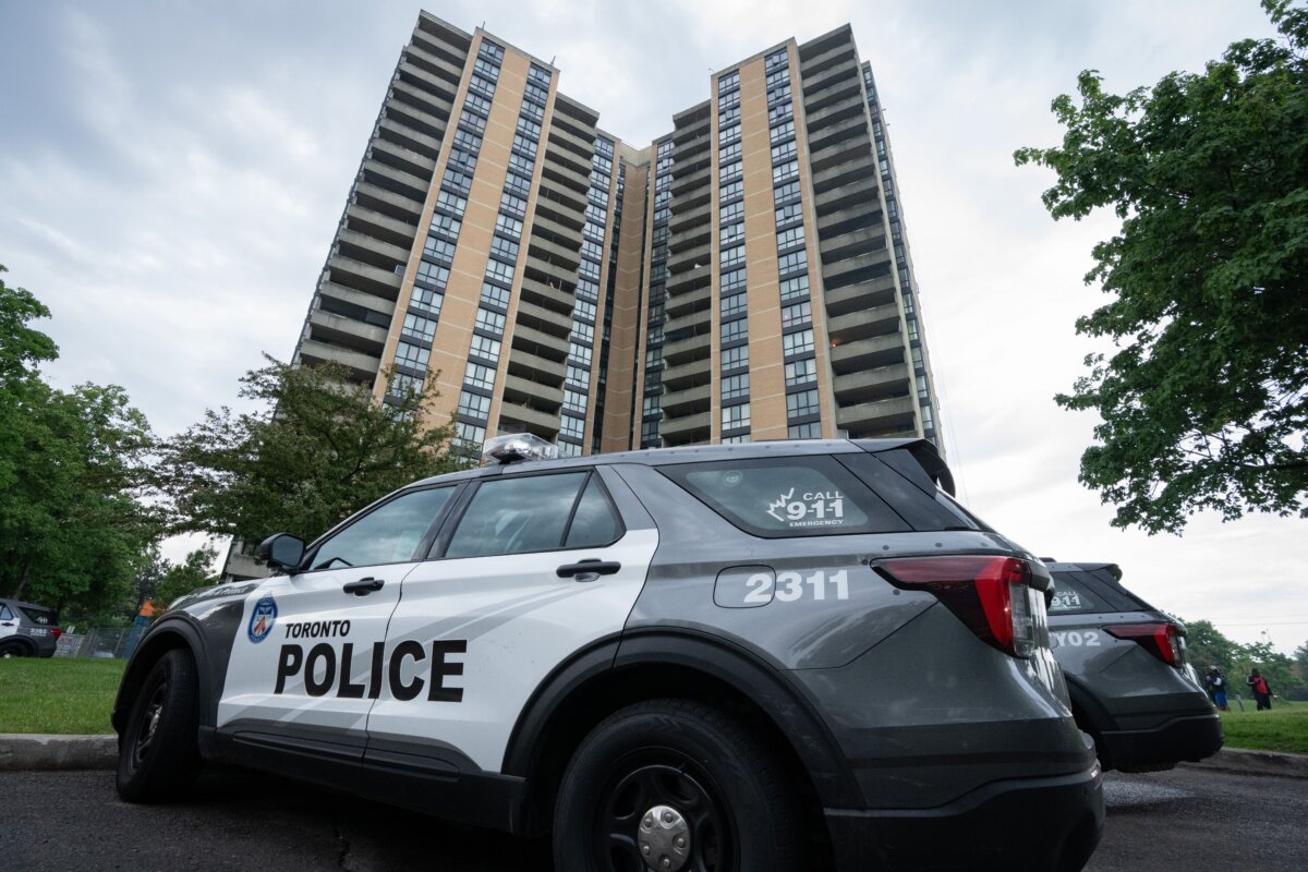Investigators work the scene where a Toronto police officer was shot at an apartment in North York on June 11, 2026. (The Canadian Press/Arlyn McAdorey)