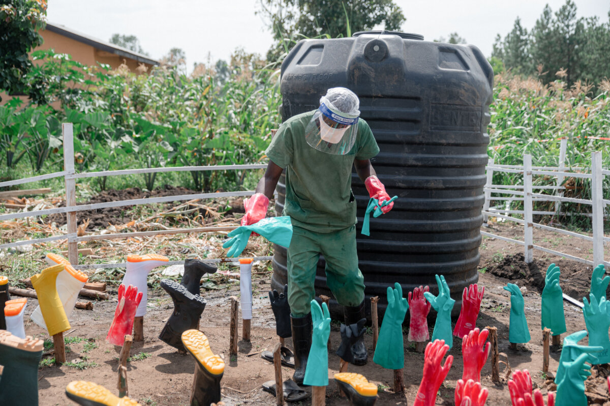 Cleaning staff wash reusable boots and gloves, disinfect equipment, and maintain common areas at the Ebola treatment center of Rwampara General Reference Hospital in Rwampara, Congo, on June 12, 2026. The measures are part of infection-control efforts for patients with confirmed or suspected Ebola virus disease. (Jospin Mwisha/AFP via Getty Images)